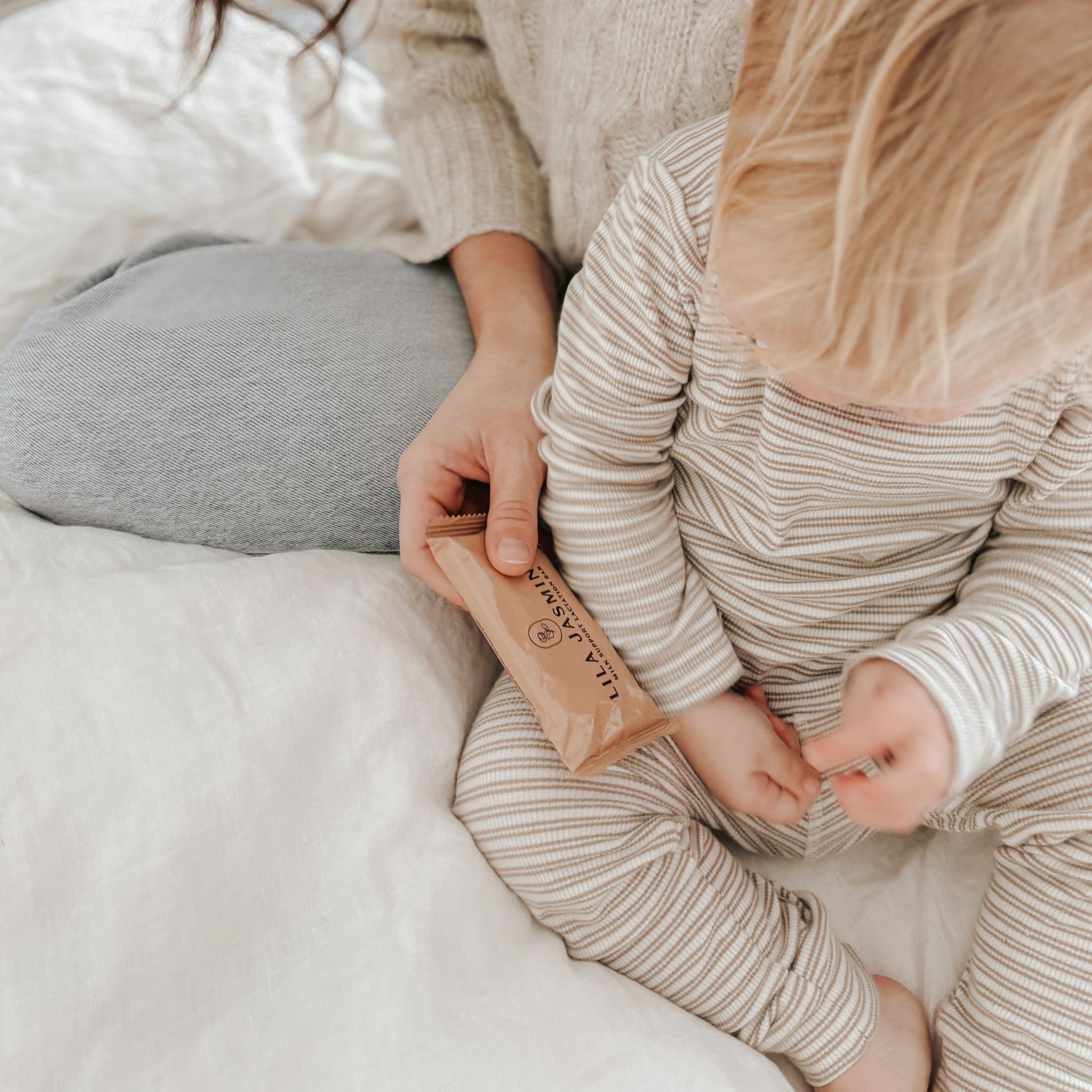 Apricot and Dark Choc Breastmilk Support Lactation Bar for breastfeeding mums. Dairy-free lactation snack with galactagogues oats, brewers yeast and flaxseeds. Mum and toddler, supporting your breastfeeding journey for as long as you want.