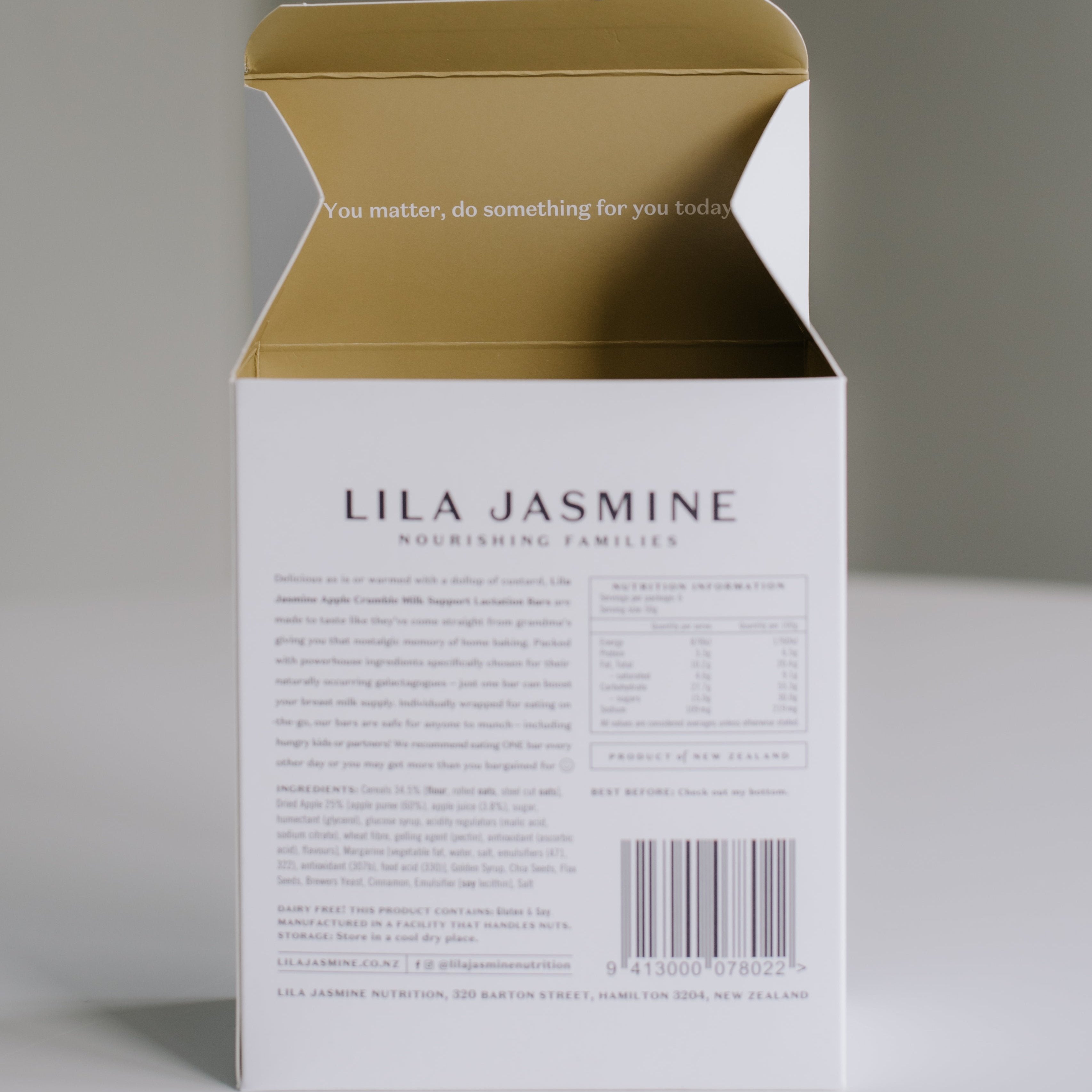 Close-up view of pack of packaging highlighting the components of the Apple Crumble Breastmilk Support Lactation Bar.