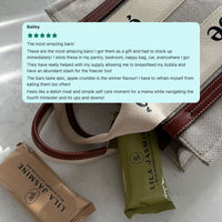 Lila Jasmine chocolate bars with a customer review overlay on a textured surface