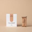 Lila Jasmine apricot and dark choc lactation bar packaging on a beige background