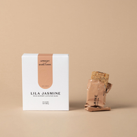 Lila Jasmine apricot and chocolate milk support lactation bar packaging on a beige background