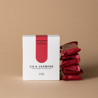 Lila Jasmine Berry & White Chocolate milk support lactation bars on a beige background