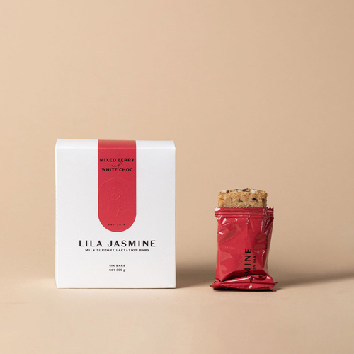 Lila Jasmine Berry & Chocolate milk support lactation bar packaging on a beige background