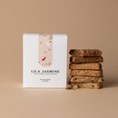 Lila Jasmine Mix of Six milk support lactation bags naked bars stacked on a beige background